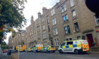 A 41-year-old man was found in a flat on Pitkerro Road
