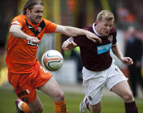 Robbie Neilson in action for United against former club Hearts in 2012.