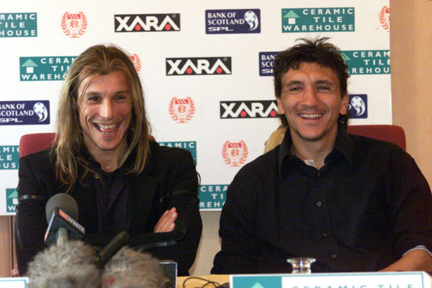 Claudio Caniggia in a press conference with his new manager after he arrived to replace Caballero in October 2000.