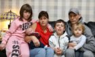 Dave Quinn at home in Dundee, with his wife Jane and kids David, 6 weeks; Harley, 1; Sophia Coupar, 9; and Ian Coupar, who is 11. Photo by Dougie Nicolson/DCT Media.