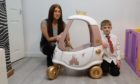 Heather Greenwood and her son Rory Wallace with the upcycled car.