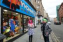 David Farry, right, owner of Yvonne's Fancy Dress shop in the Seagate in Dundee, with manageress Mandy Napier.