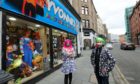 David Farry, right, owner of Yvonne's Fancy Dress shop in the Seagate in Dundee, with manageress Mandy Napier.