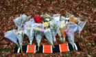 Flowers were left near to the scene of the accident by a number of people. Photo by Gareth Jennings/DCT Media.