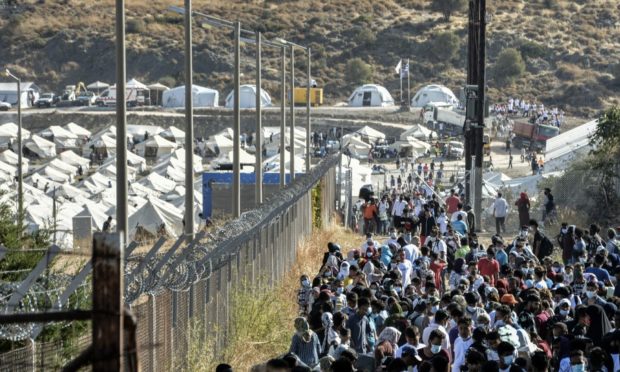 People gather at a temporary refugee camp in Kara Tepe. Lesbos in September 2020.
(AP Photo/Panagiotis Balaskas)