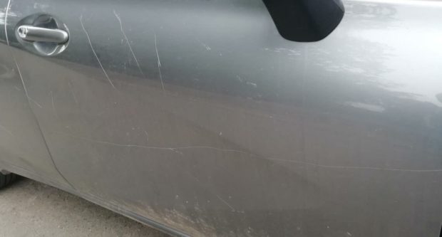 Scratches from a car that was vandalised.