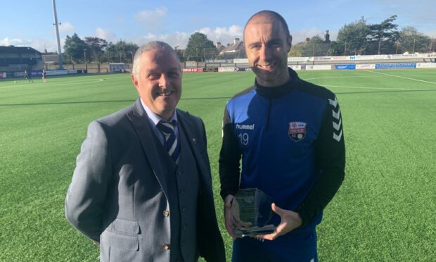 Sean Dillon received a trophy for making 150 appearances for Montrose from Director Brian Petrie.