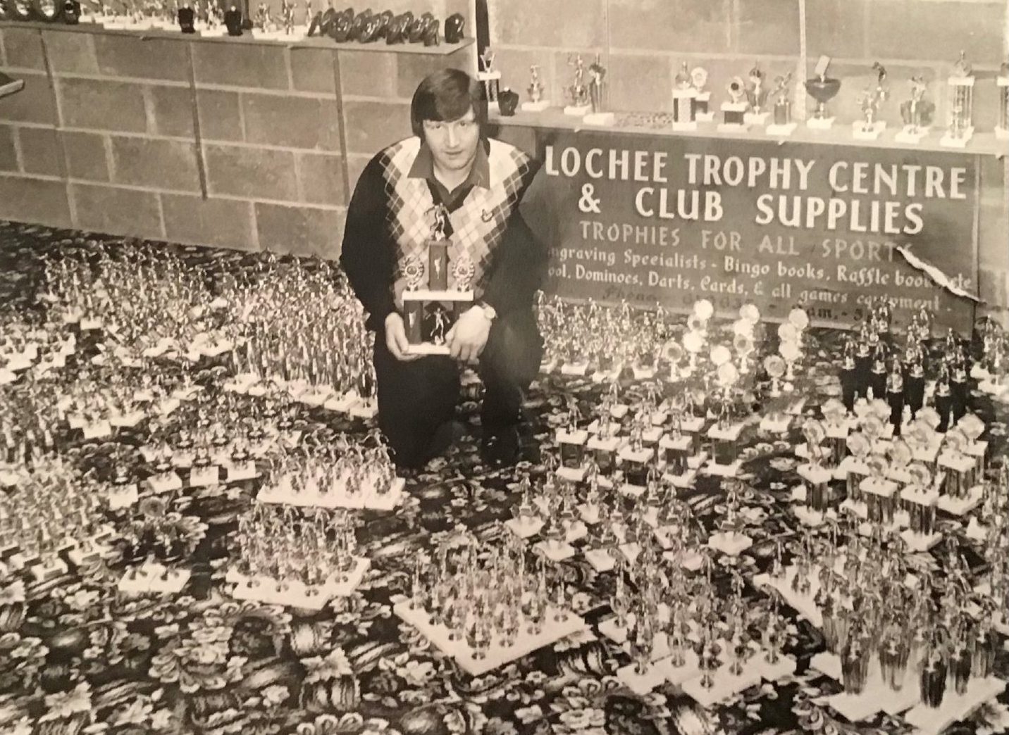 Dundee Sunday Welfare AFA match secretary Jim Don with the amount of trophies purchased for the end-of-season awards.