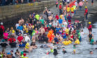 The swimmers take to the water, Broughty Ferry on New Year's Day 2020. Kim Cessford / DCT Media.