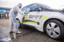 Sterilisation expert Stephen Roberts giving a Zippy D car a deep clean.