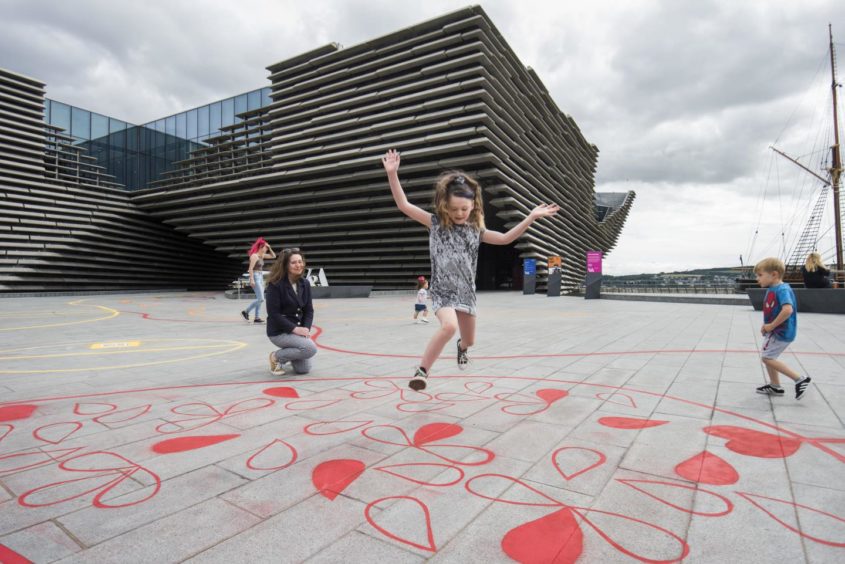 Lexi Laurie, 9, plays on an interactive playground with Kirsty Hassard, Curator at V&A Dundee shortly after the post-lockdown re-opening in 2020.
