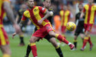 Martin Woods in action for Partick Thistle last season