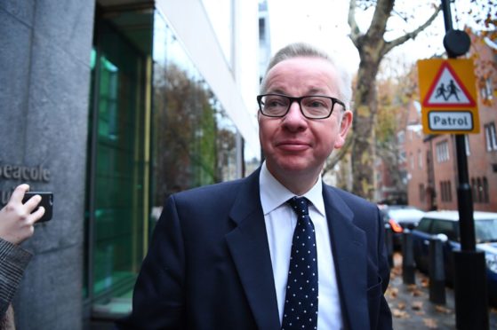 Michael Gove arrives at his office in Westminster, London.