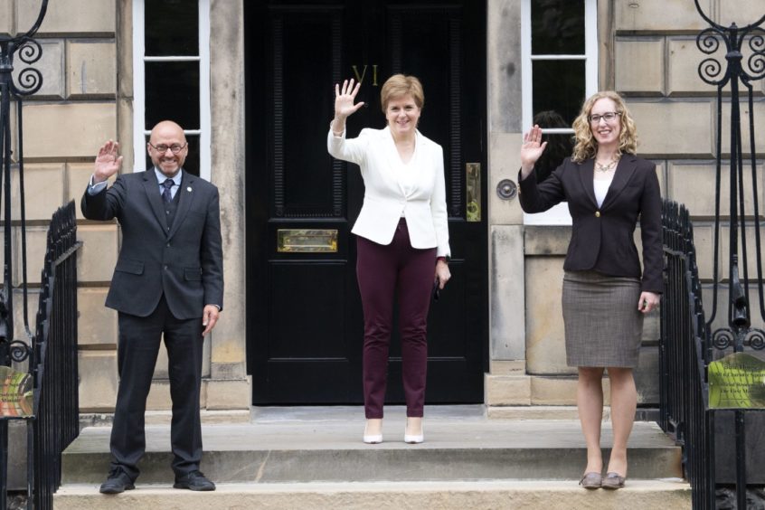 Nicola Sturgeon and Scottish Greens co-leaders Patrick Harvie and Lorna Slater on the steps of Bute House.