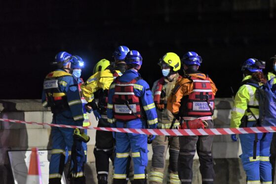 Fire crews, police and coastguard are all involved in the emergency response at the River Tay in Perth. (Pic Stuart Cowper).