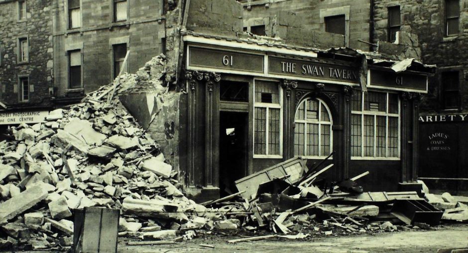 The last of the Swan Tavern during its deomolition in 1963. It sat at the junction of Barrack Street and the Overgate.