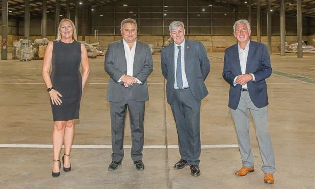 Service manager economic development in Fife Council Pamela Stevenson, co-founder and director of Yes Recycling Omer Kutluoglu, Councillor Altany Craik and employer engagement co-ordinator in Fife Council John McFarlane at the opening of the Fife facility. Image: FIfe Council.