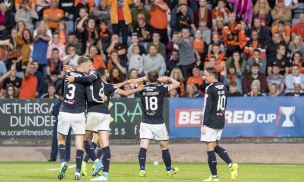 Paul McGowan celebrates a derby winner in front of Dundee United fans in 2017.