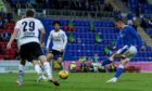 Glenn Middleton hits a shot in St Johnstone's second leg tie against LASK in the Europa Conference League qualifier at McDiarmid Park.