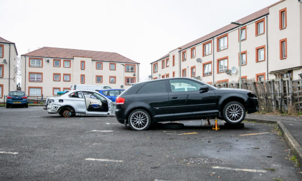 Two of the vehicles situated within the communal car park.