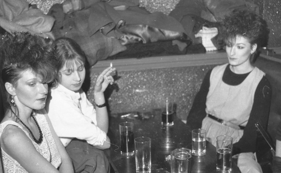 These women take a break from dancing at Club Feet in the 80s.