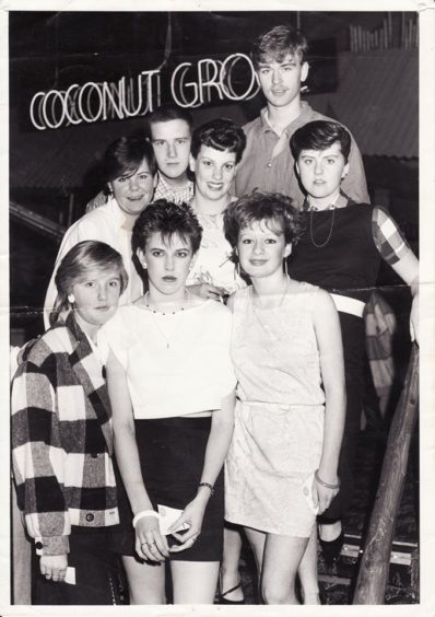 This image from Tele reader Brian Mill shows a him with a group of palls at the Grove in the 80s.