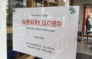 A notice on the door of the surgery in Glover Street, Perth.
