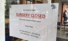 A notice on the door of the surgery in Glover Street, Perth.