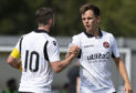 Lawrence Shankland celebrates with Nicky Clark after finding the net against Dumbarton, pre-season.