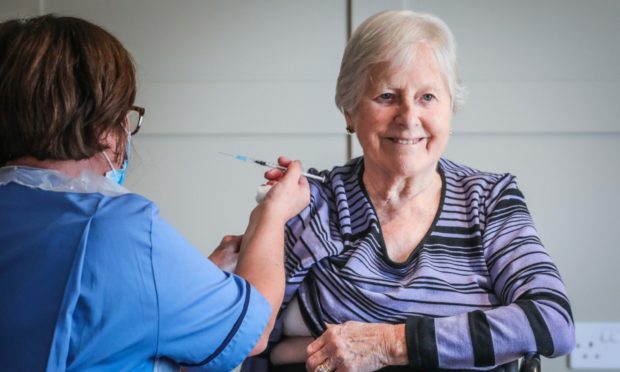 Perth care home resident Sheena Cargill receives her booster Covid jab.