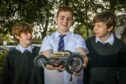Ethan Mundy, Reuben Watkinson and Brodie Young with their model.