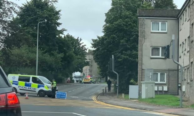 A man has been taken to hospital after being hit by a lorry in Perth
