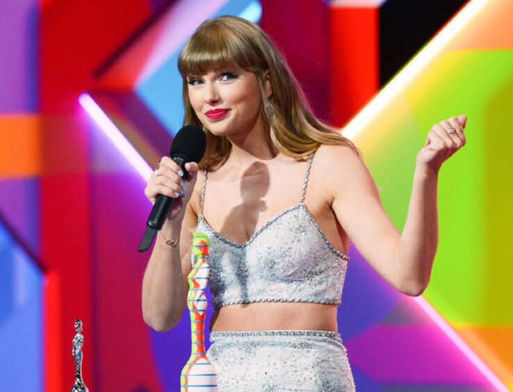Image shows singer Taylor Swift on stage at the Brit Awards in 2021. Taylor is one of April Jai's favourite musicians.