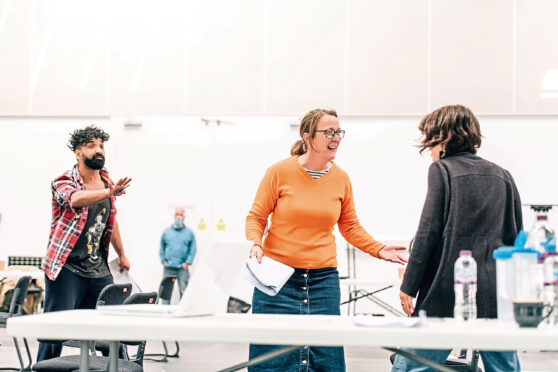 Taqi Nazeer, Gabriel Quigley and Hannah Donaldson rehearsing for The Enemy.