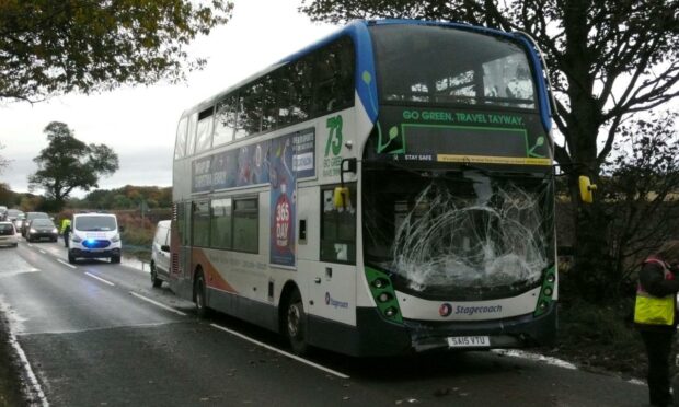 A Stagecoach bus with a cracked windscreen after a crash in Angus.