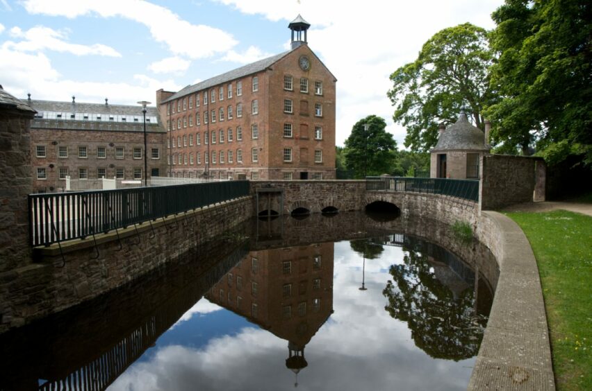 Stanley Mills, showing large five storey mill building with lade in front