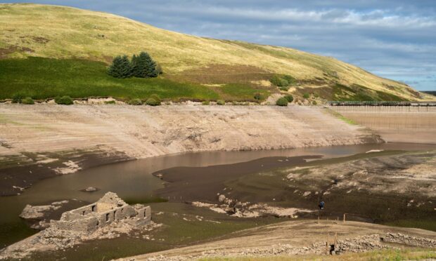 A farmhouse and sheilings submerged in 1955 emerge from Upper Glendevon Reservoir during low water levels. Picture: Calum Gillies.