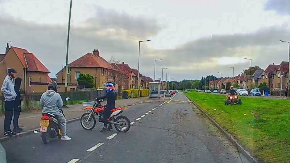 A still from dashcam footage of youngsters on illegal bikes in Kirkton, Dundee