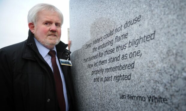 Ian Nimmo White in 2013 with the poem he wrote in memory of the Tay Bridge Disaster