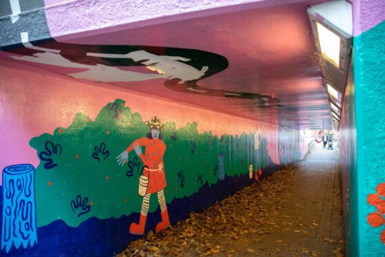 The ceiling of the mural has been damaged by vandals