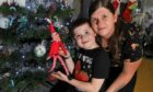 Shawnee Milne and her son Barry, 7, won our elf on the shelf competition with their elf John.