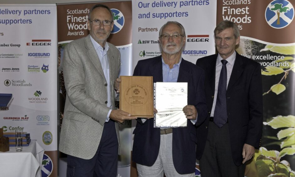 Maarten Versteeg and Ian Philip receive the award for Kincladie Wood from Chris Ingles, Chair of Scotland's Finest Woods Awards.