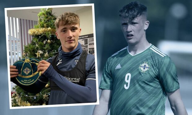 Lewis McCann with his award