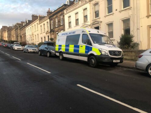 Officers had to force entry to the property in Dundee's West End.