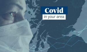 A person wearing a mask with the text Covid in your area over a map of Scotland, including Dundee, Fife, Angus and Perth and Kinross