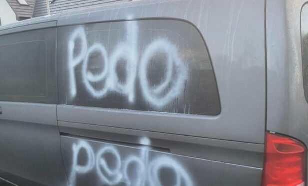 A tourist's car was daubed with graffiti described as 'obscene' by a councillor.