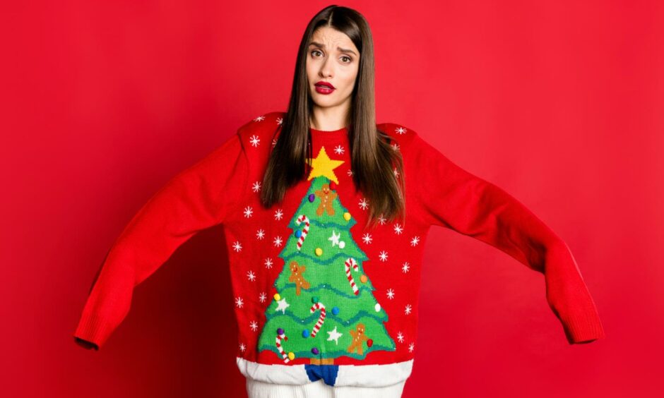 Christmas consumer rights - woman in oversized jumper.