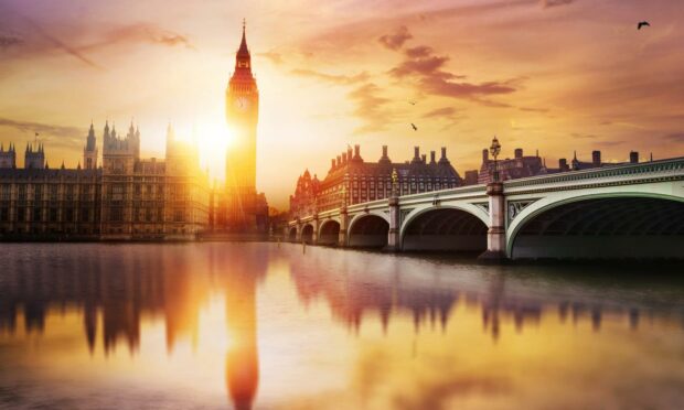 Big Ben and Westminster Bridge at dusk, London.