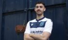 Dundee midfielder Shaun Byrne models the new Dundee FC 3rd strip