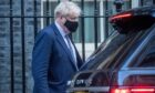 Boris Johnson on his way to PMQs, where he faced repeated calls to resign, on Wednesday. Photo by MI News/NurPhoto/Shutterstock.